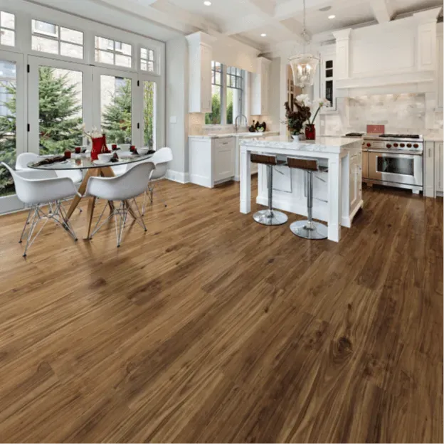 A kitchen with hardwood floors and a table and chairs