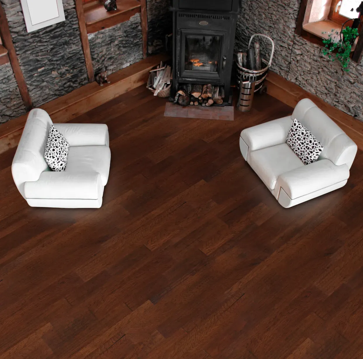 A living room with two chairs and a fireplace