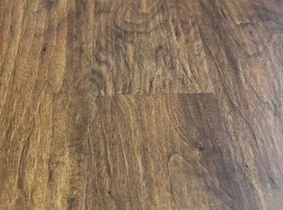 A close up of a wooden floor with a grainy texture.