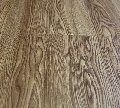 A close up of a wooden floor with a grain pattern.