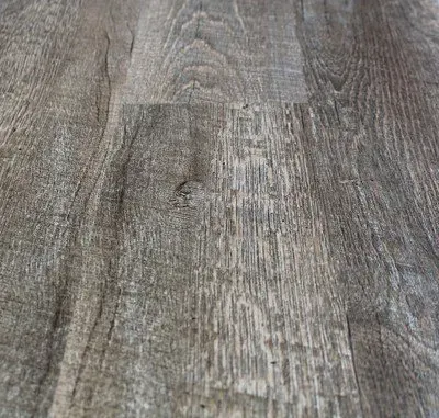 A close up of a wooden floor with a grain and texture.
