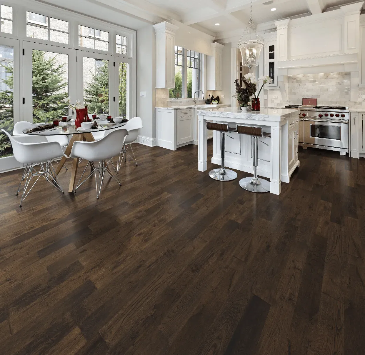 A kitchen with hardwood floors and a table and chairs