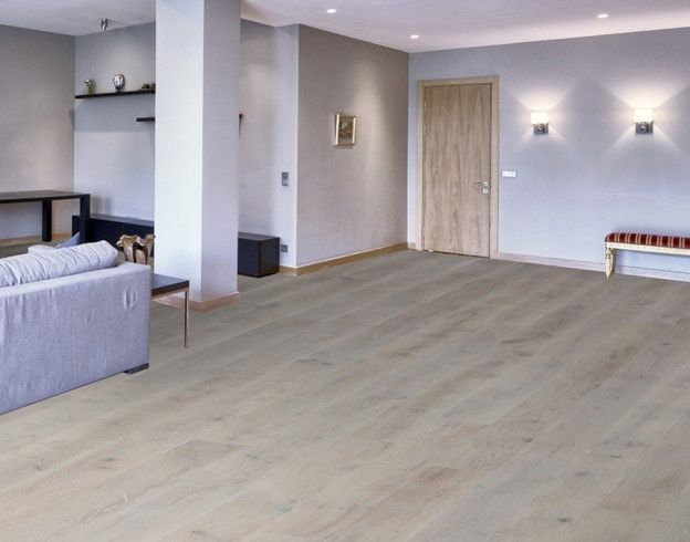 A living room with hardwood floors and a couch