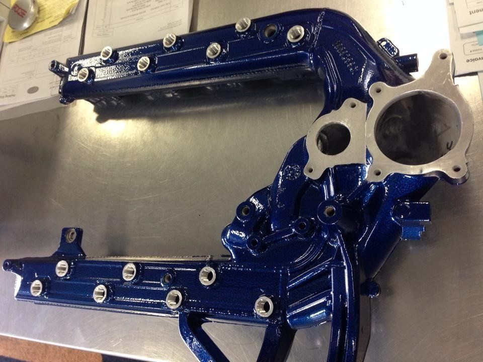 A blue piece of metal is sitting on a table