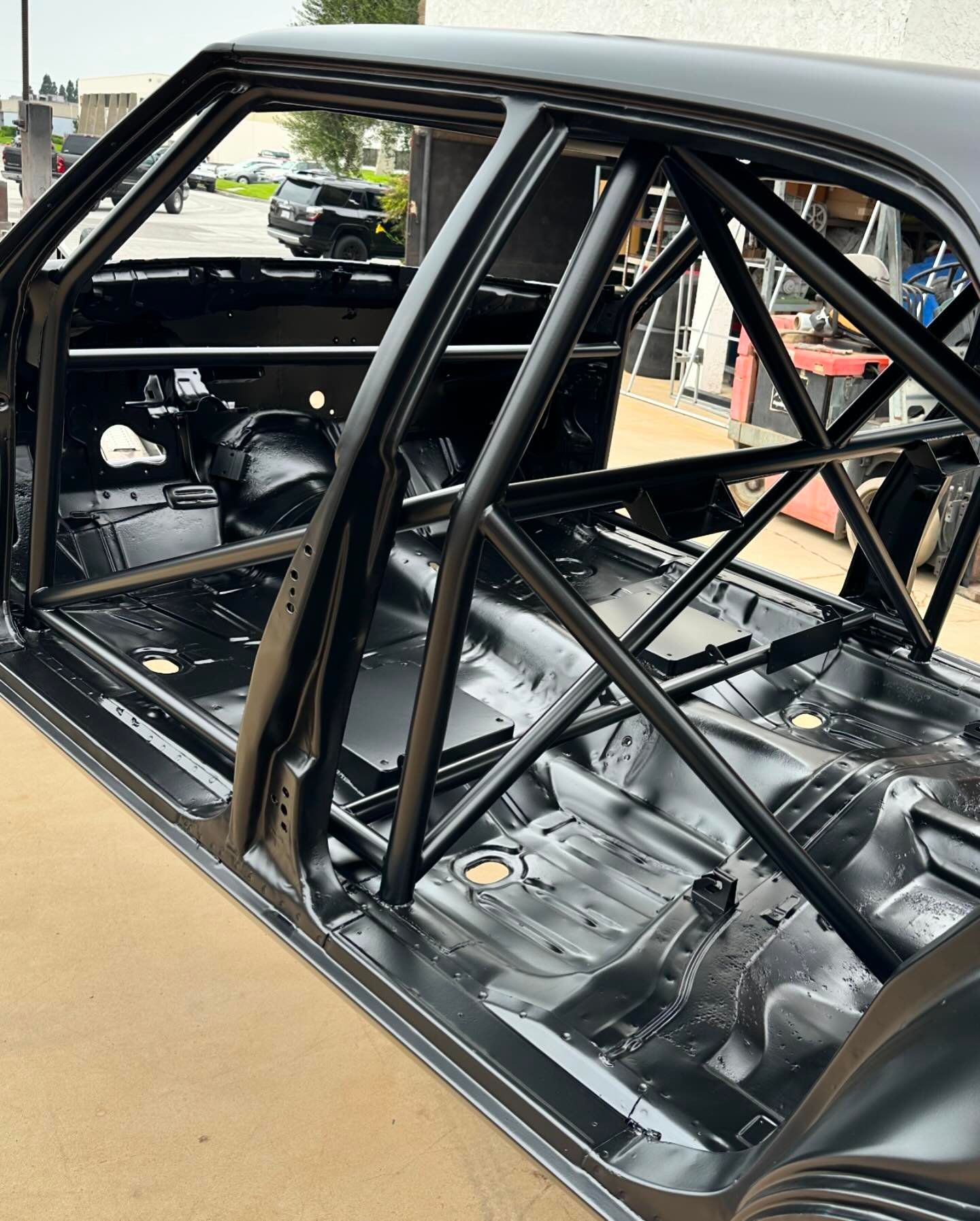 The inside of a car with a cage on it.