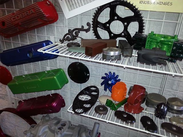 A bunch of different colored parts are displayed on shelves