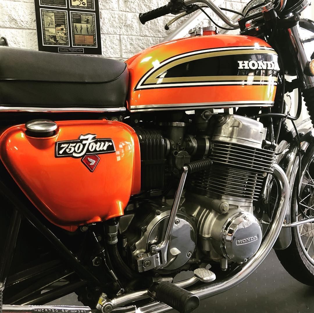 A honda 750 tour motorcycle is parked in a garage