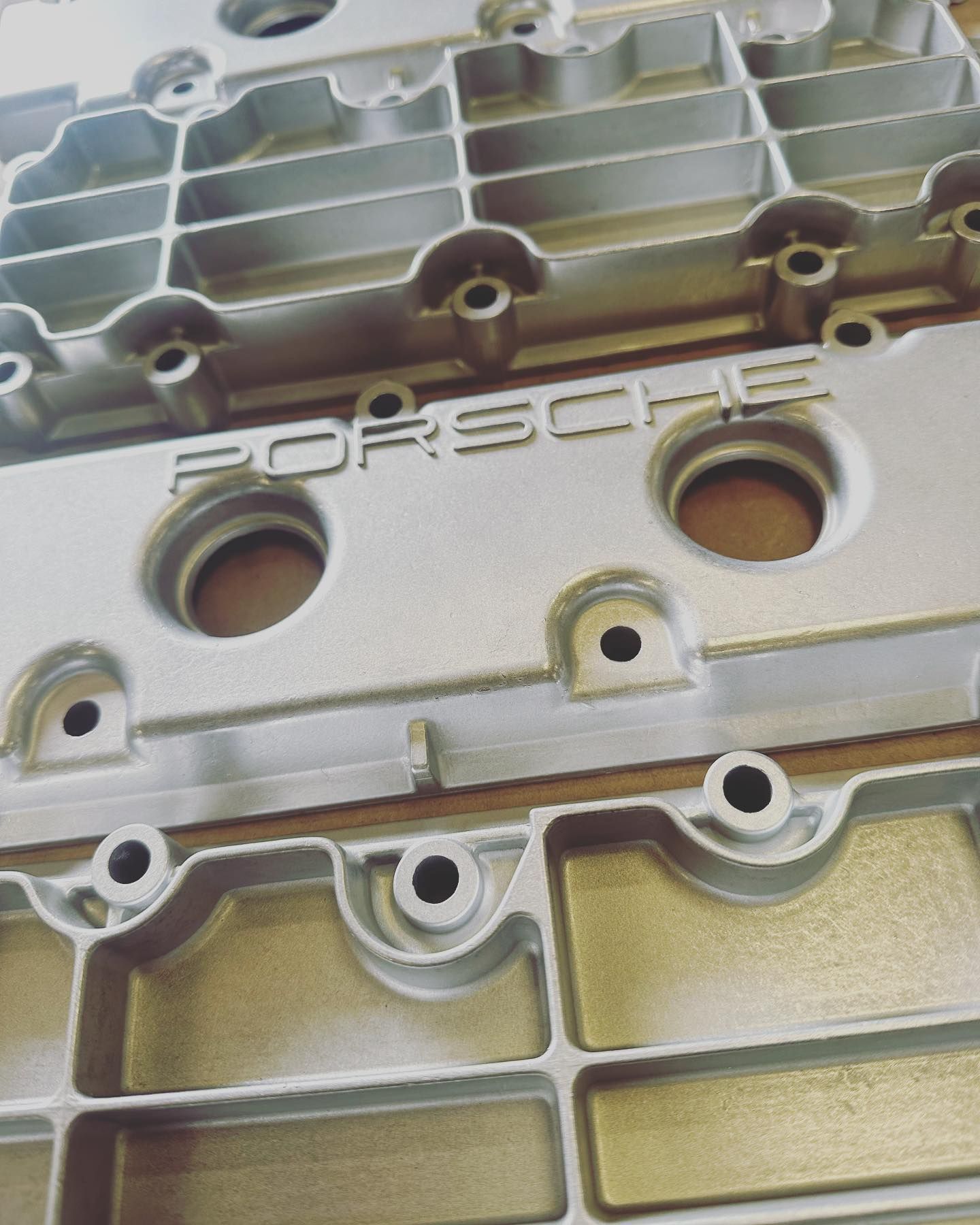 A close up of a porsche engine cover