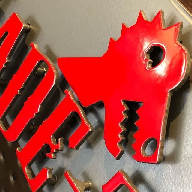 A bunch of red keys shaped like a dragon