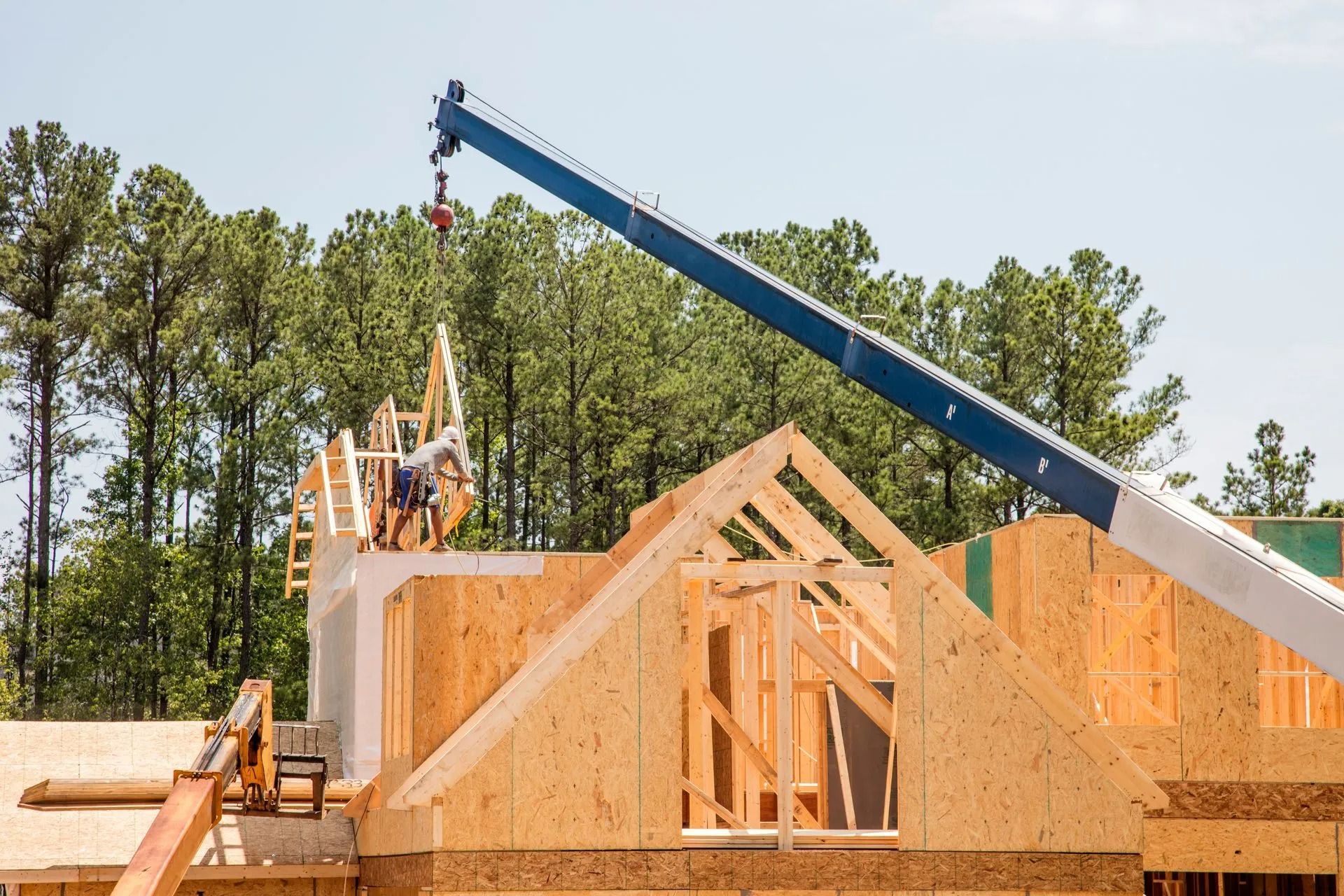 Multi-story residential home with a blue sky.