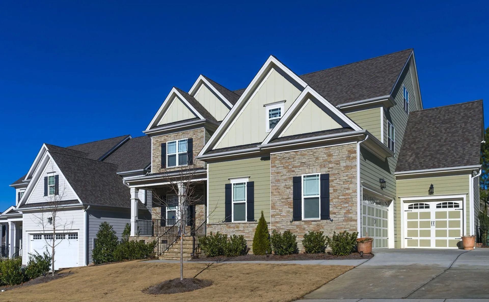 Multi-story residential home with a blue sky.