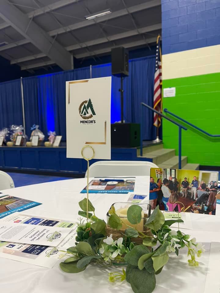 A table display, a sign for the company 
