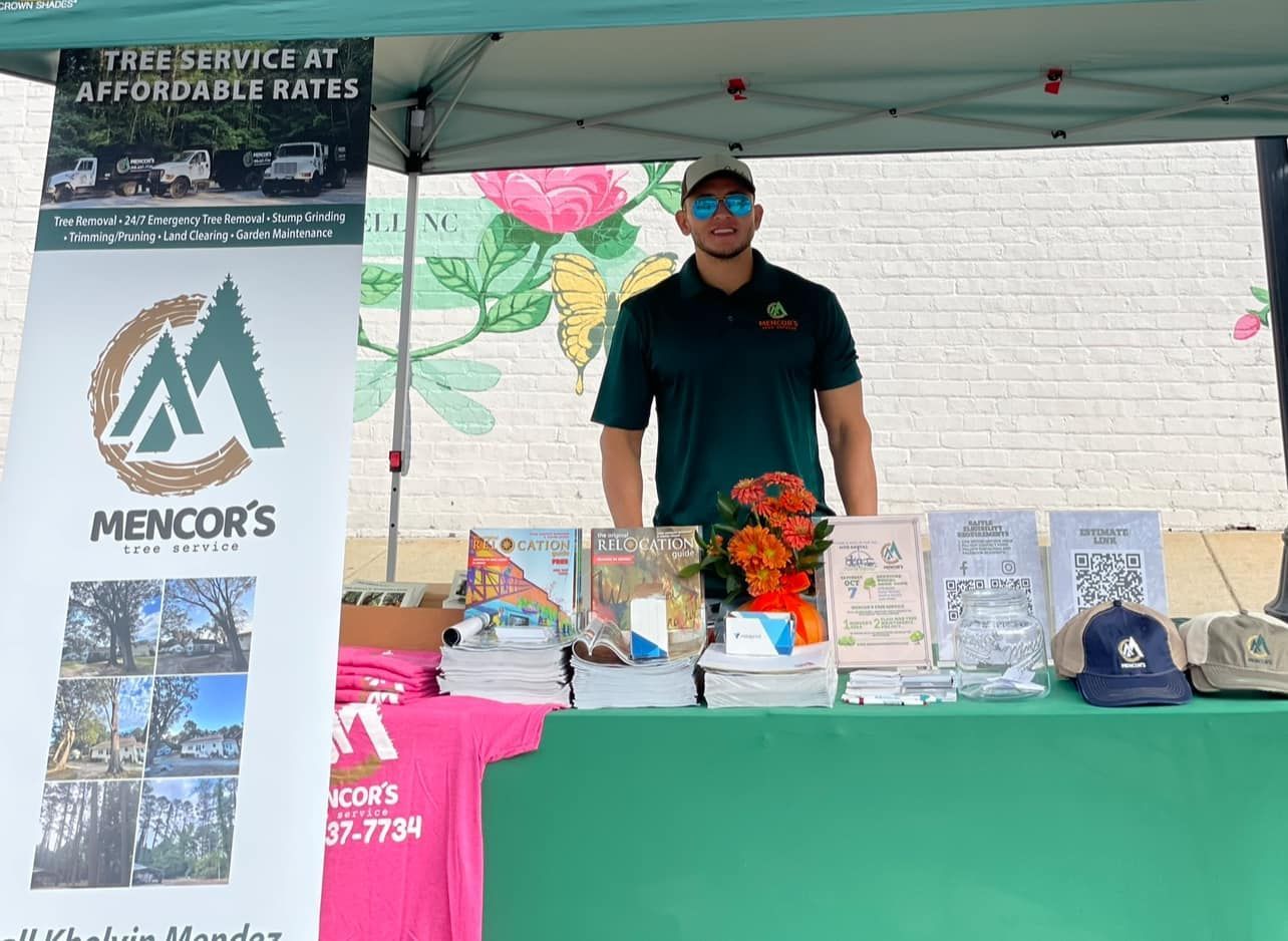 Man behind a booth advertising 