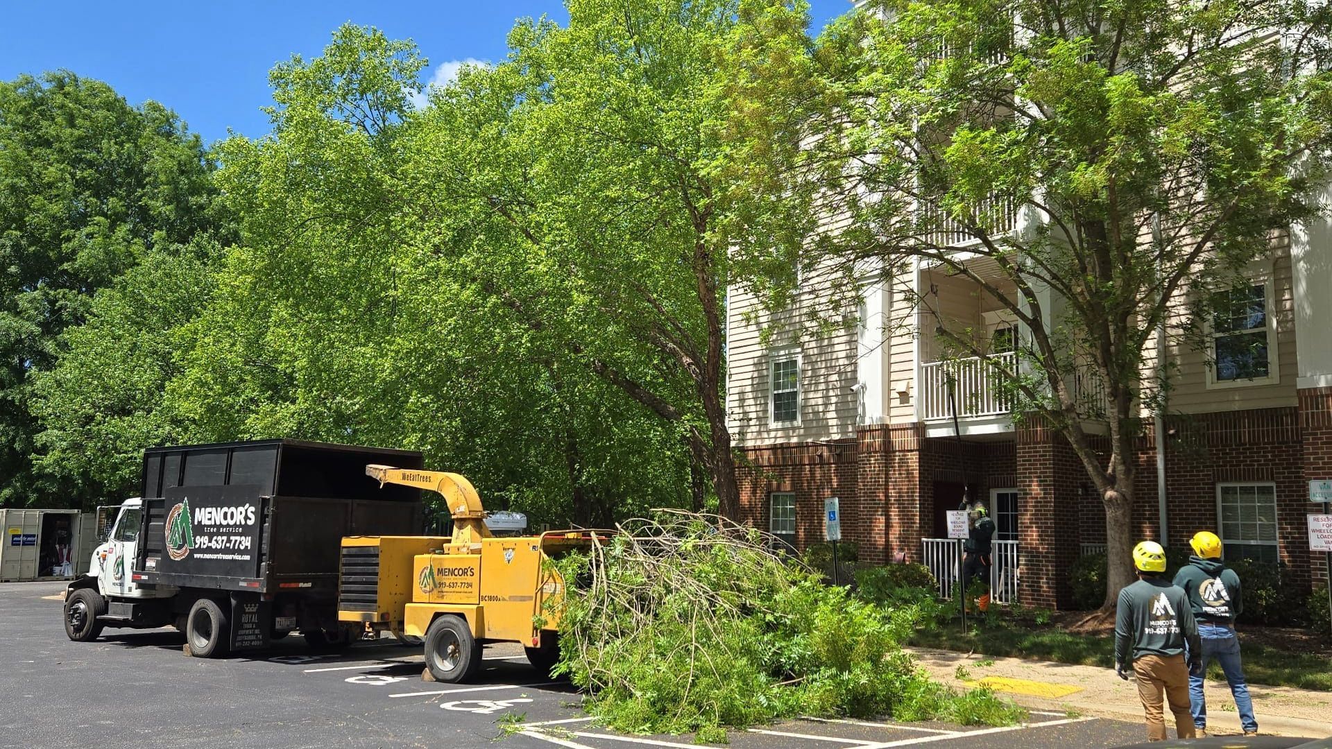 A couple of trucks parked in front of a building.