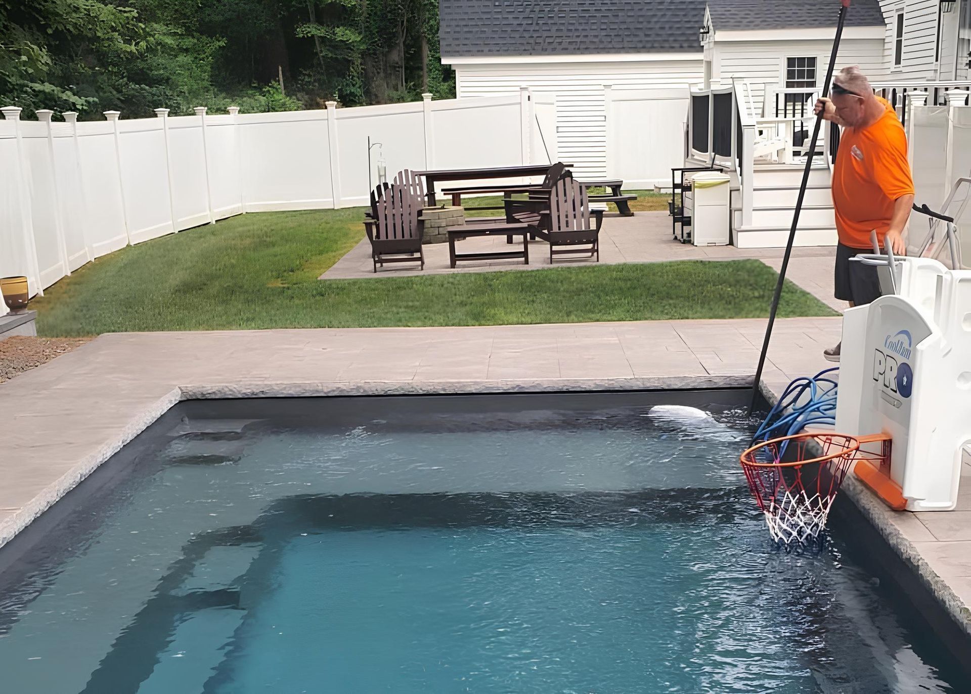 Colorful inflatable rings floating in a blue swimming pool.