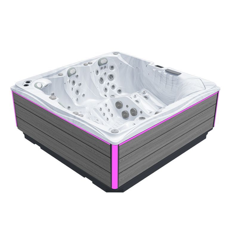 White corner hot tub with gray exterior and purple accent lighting on a white background