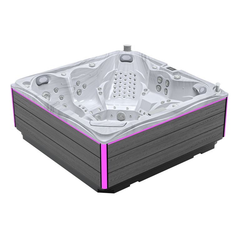 White corner hot tub with gray exterior and pink accent lighting