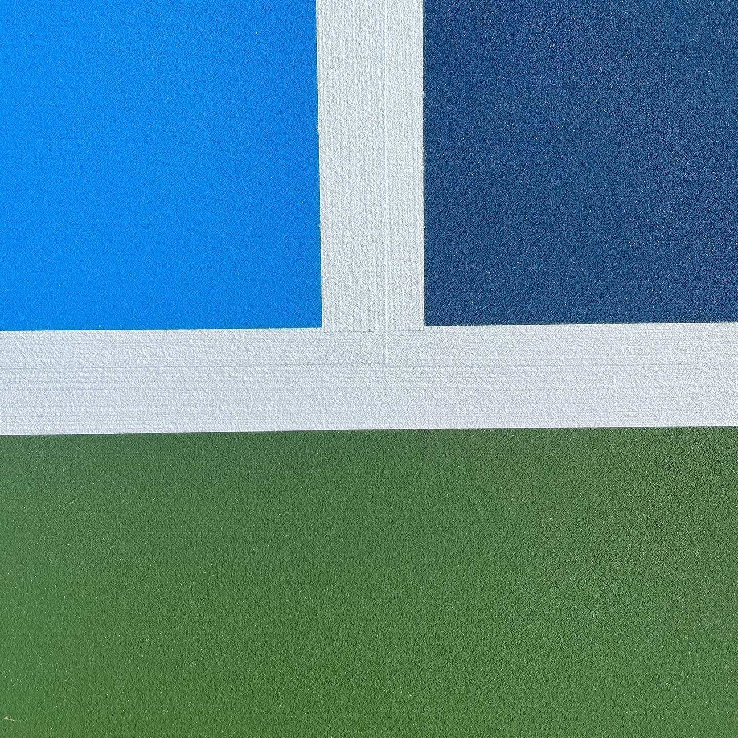 Abstract geometric flag with blue, white, and green sections