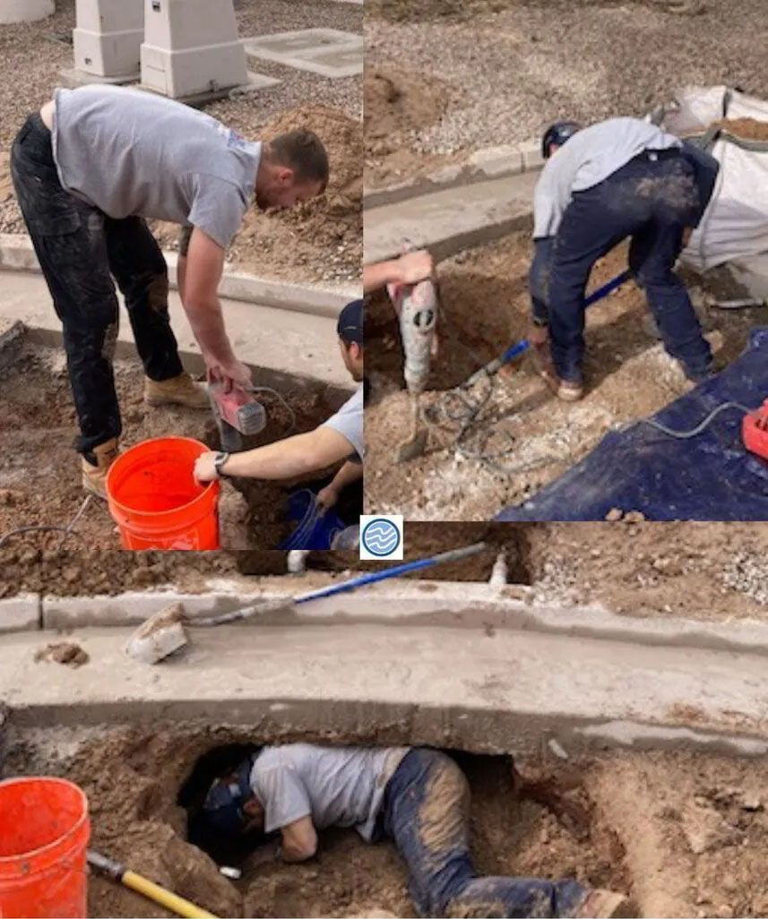 Workers digging and cleaning a trench beside a concrete curb, with an orange bucket nearby.