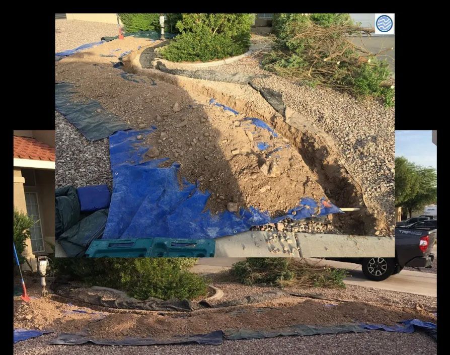 Collapsed dirt slope with erosion and blue tarp covering part of a hillside beside a driveway.