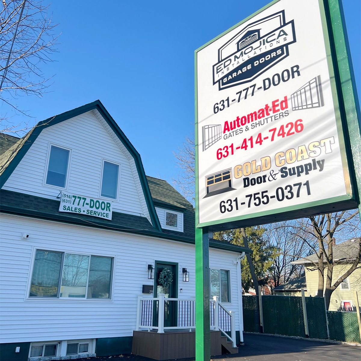 Garage door samples displayed in a showroom with color swatches and hardware options.