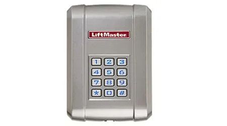 Silver LiftMaster keypad with number buttons.