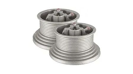 Two silver garage door torsion springs.