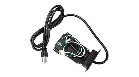 Black electrical component with power cord and wiring.