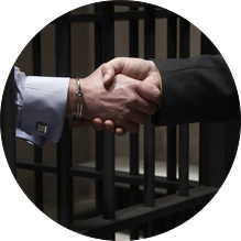 Lawyer shaking hands with arrested man