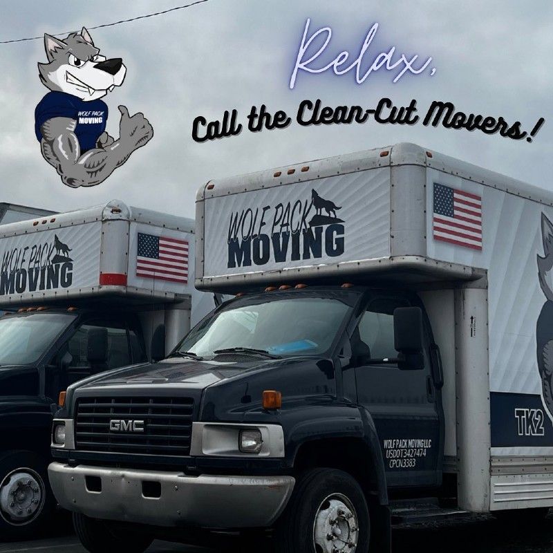 Two moving trucks with a wolf mascot and text 