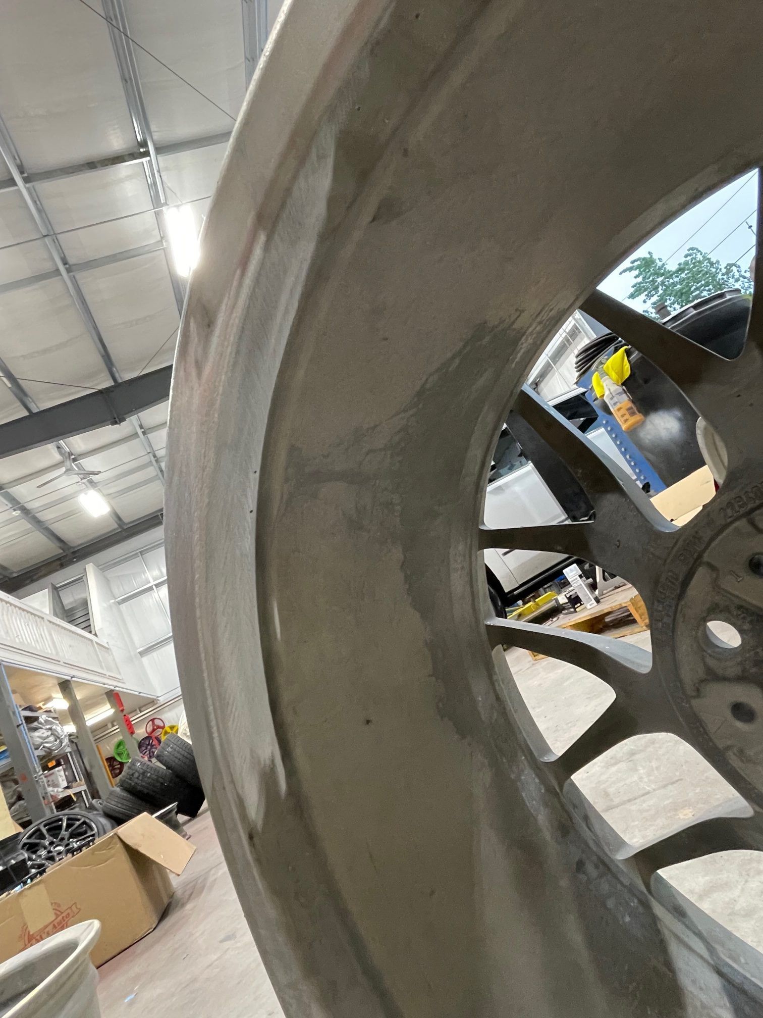 A close up of a wheel in a warehouse.