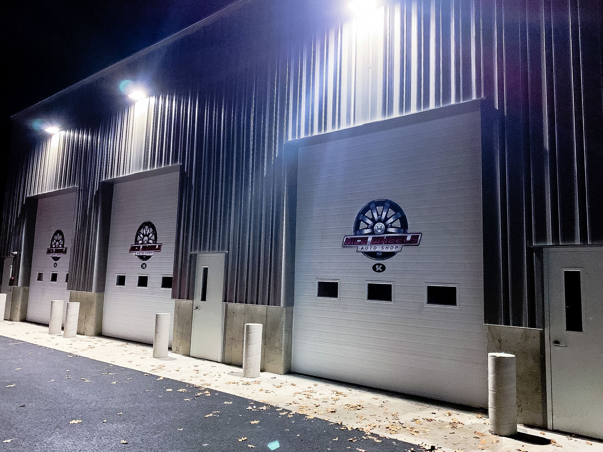 A row of garage doors with a tree logo on them