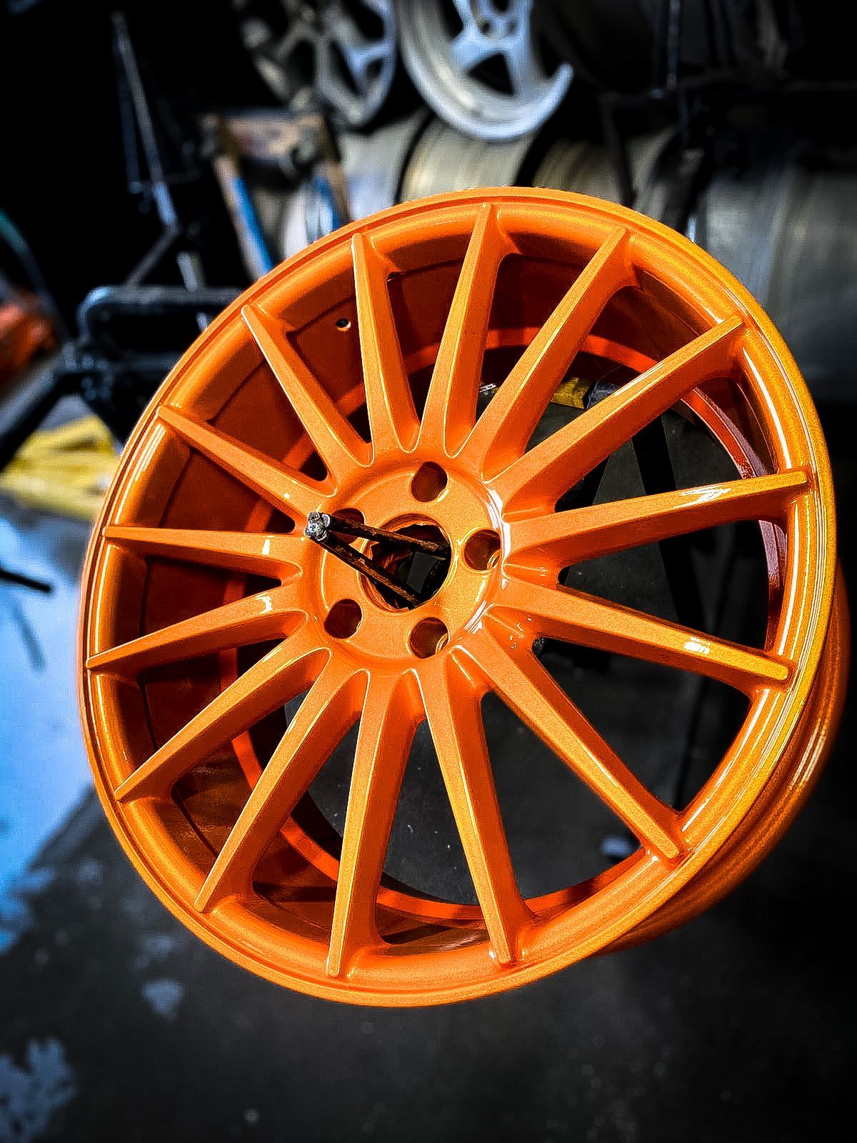 A close up of an orange wheel on a table