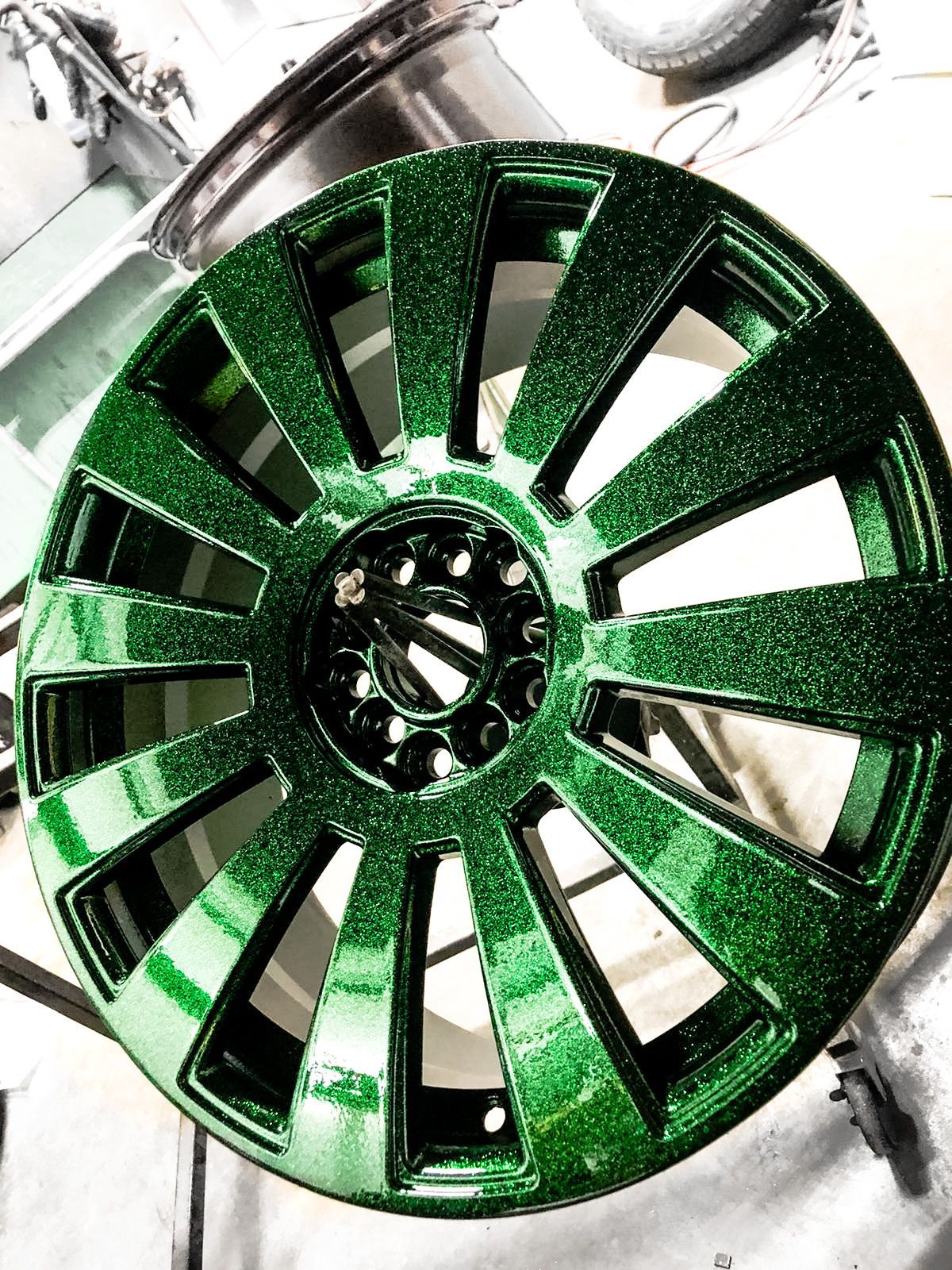 A green wheel is sitting on top of a table.