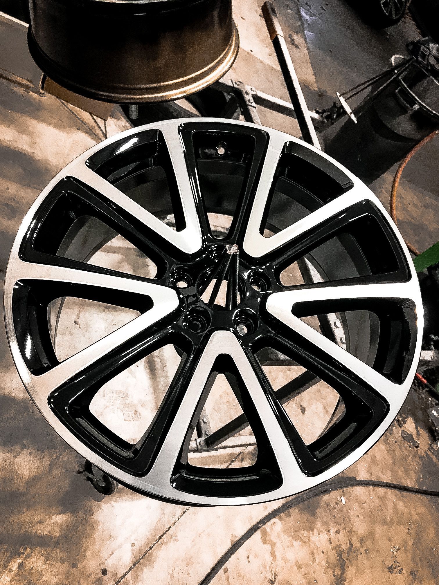 A black and white wheel is sitting on a table.