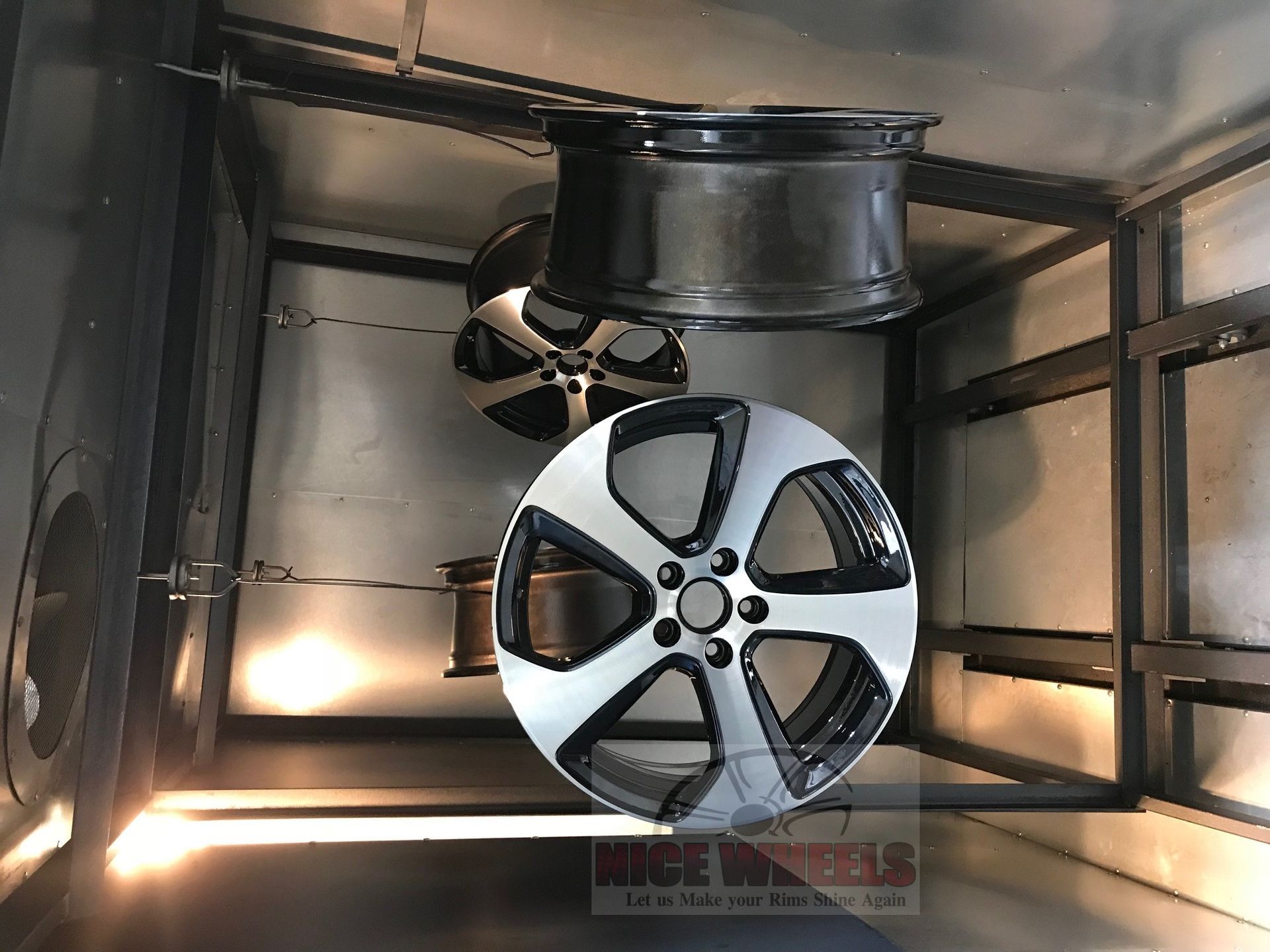 A couple of wheels are sitting on top of each other in a room.