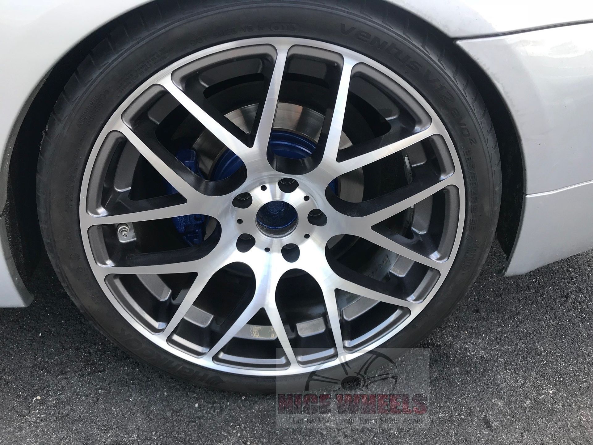 A close up of a car wheel with the word wheels on it