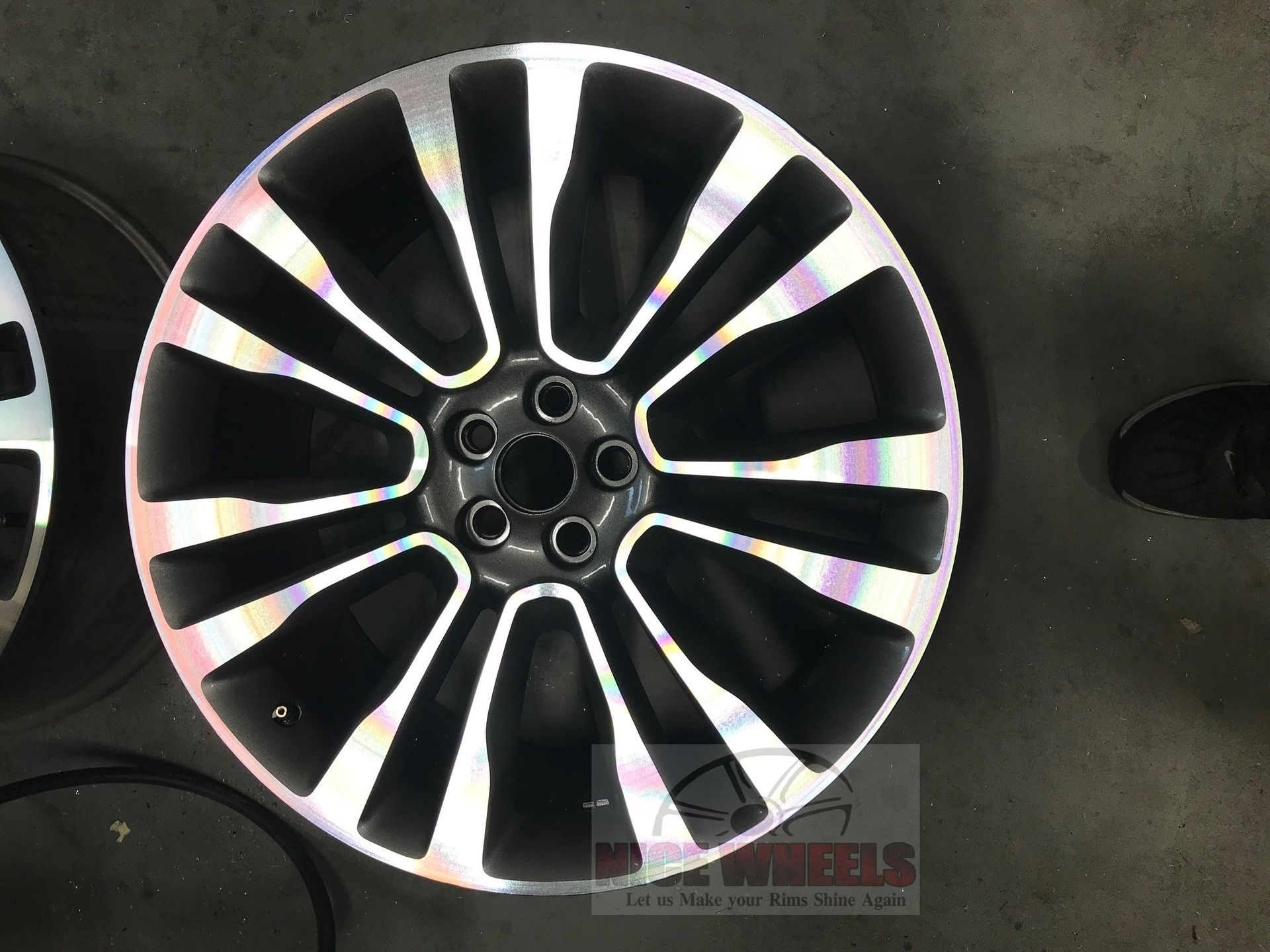 A pair of black and silver wheels with the word wheels on the bottom