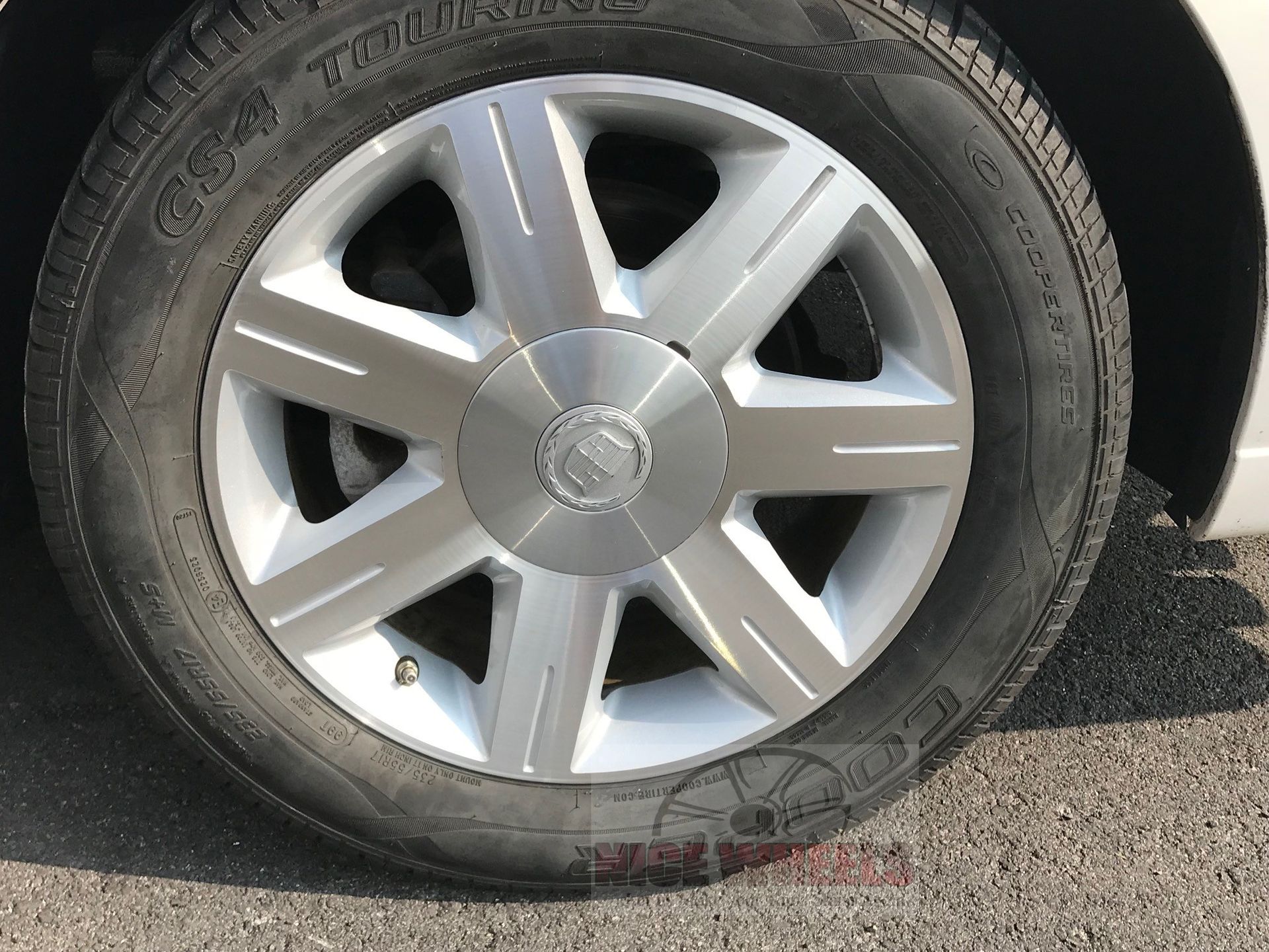 A close up of a car wheel with a tire on it