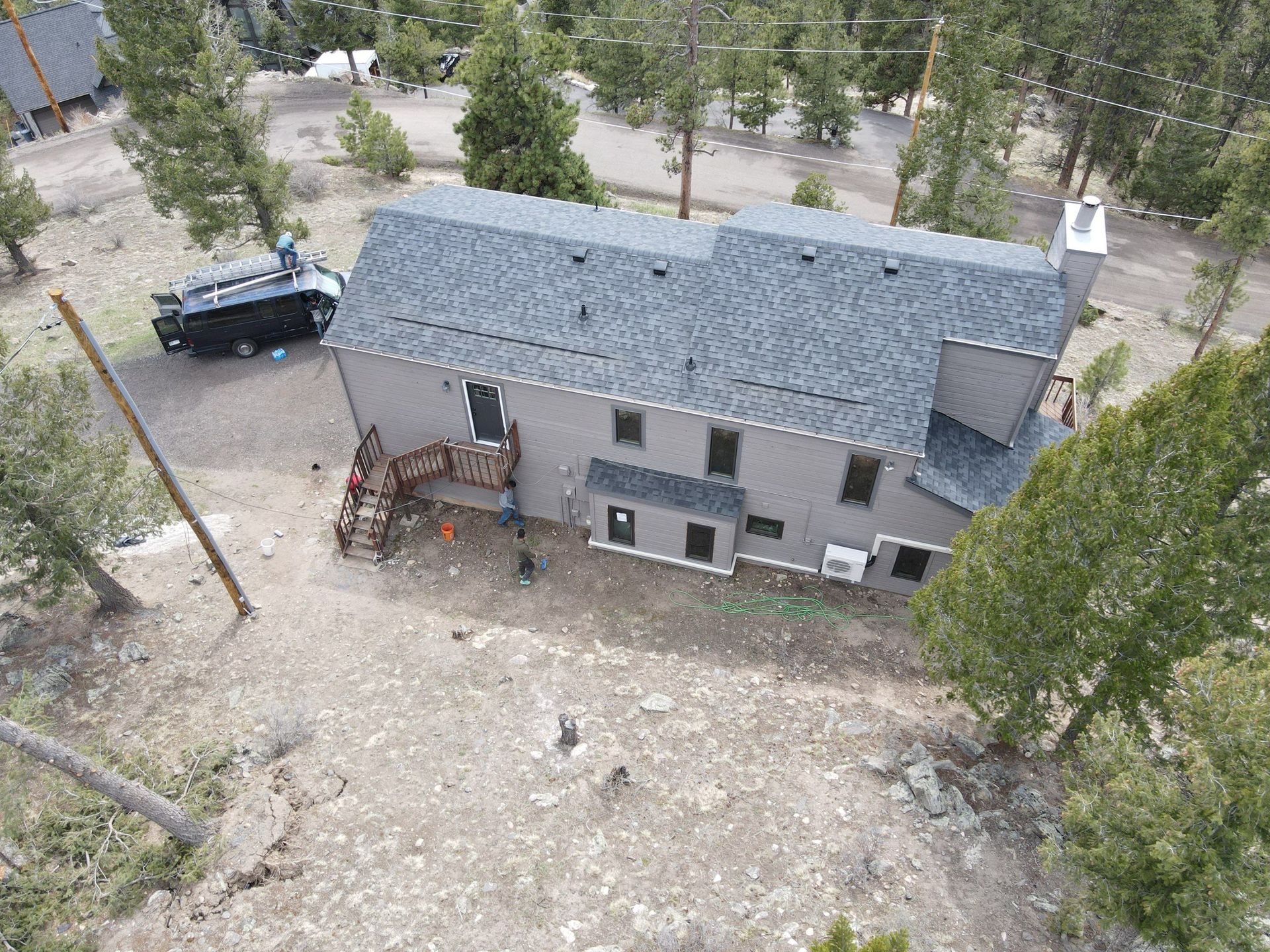 An aerial view of a house with a truck parked in front of it.