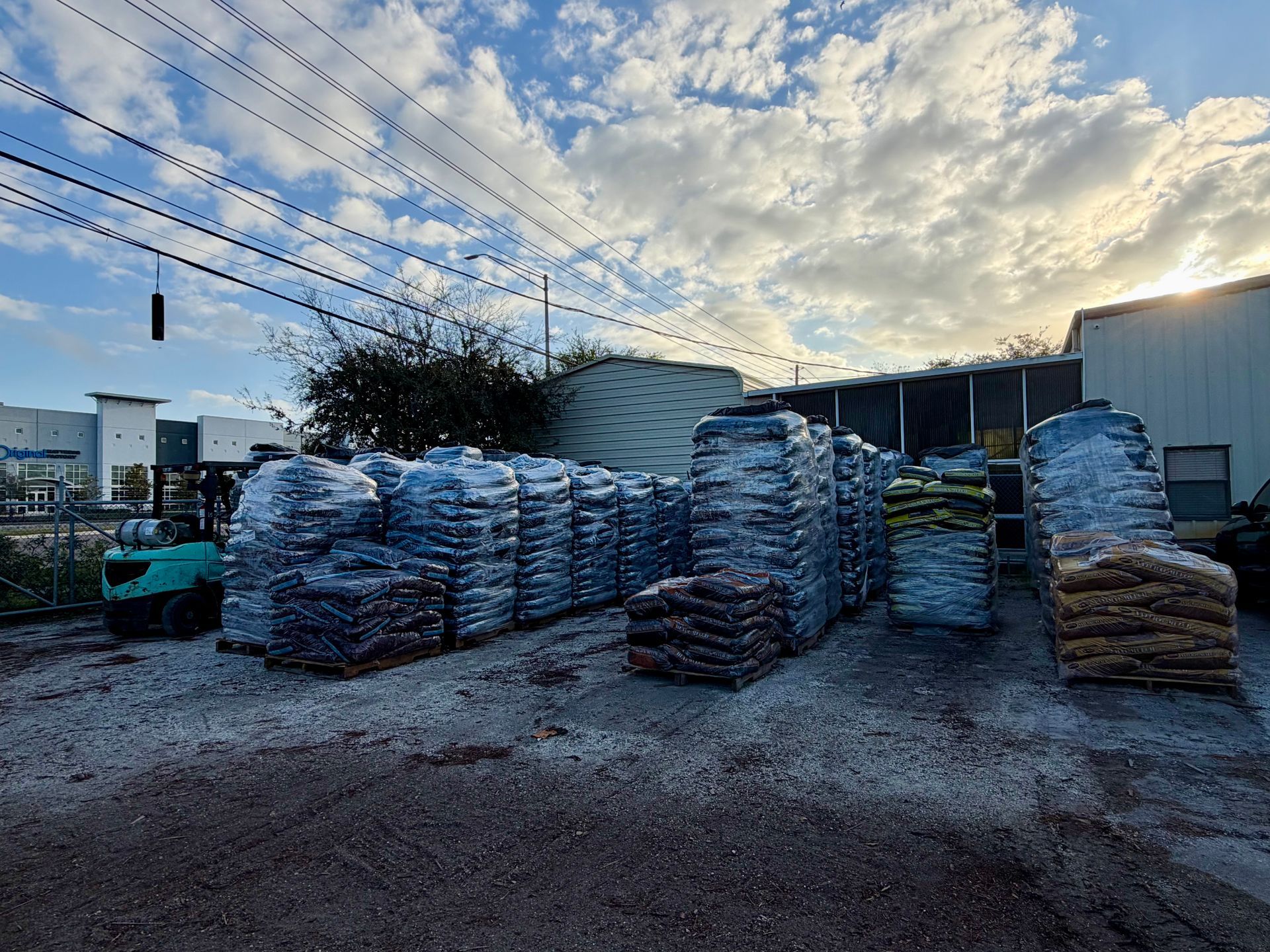 Pallets of bags and Landscaping materials stacked