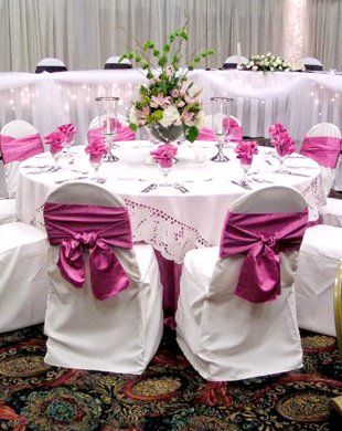 White and pink table and chair settings.