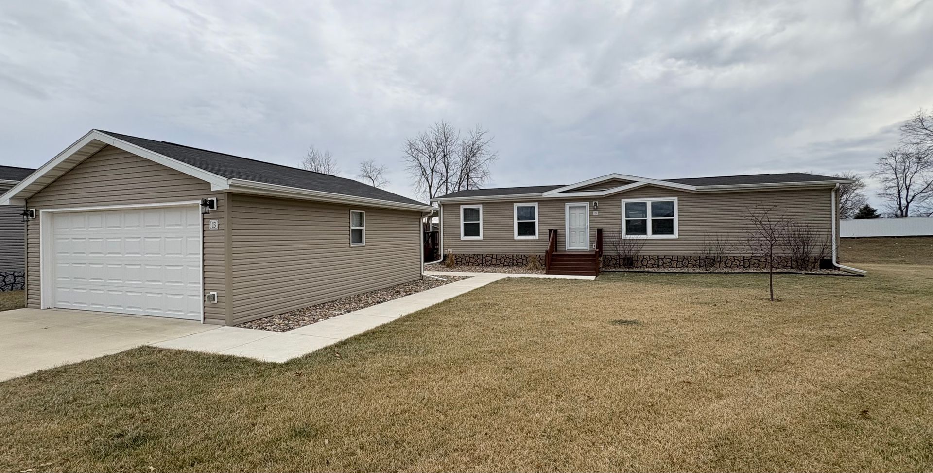 Floor plan of a house with master bedroom, living room, kitchen, and two additional bedrooms.