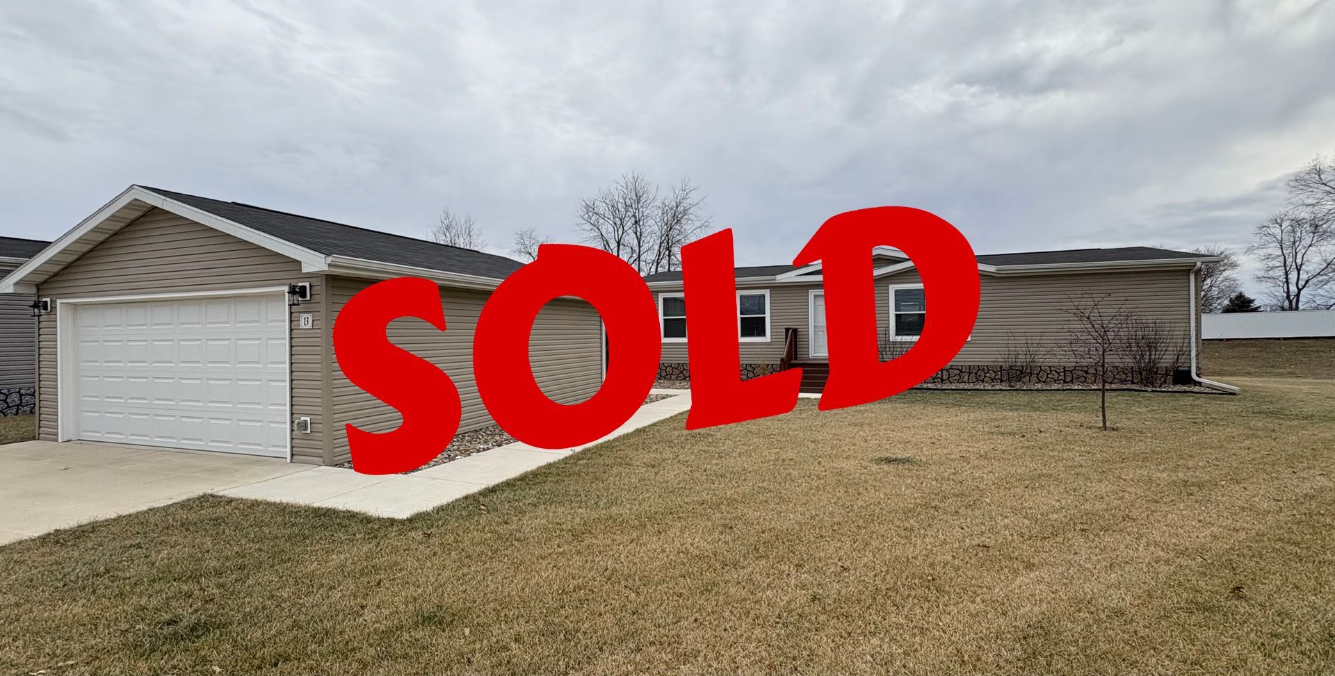 Floor plan of a house with master bedroom, living room, kitchen, and two additional bedrooms.