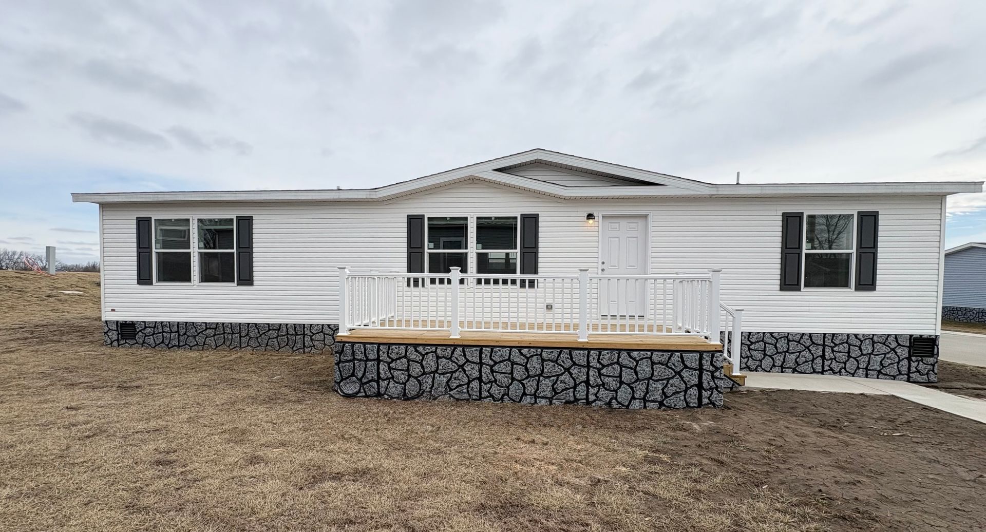 Floor plan of a house with master bedroom, living room, kitchen, and two additional bedrooms.