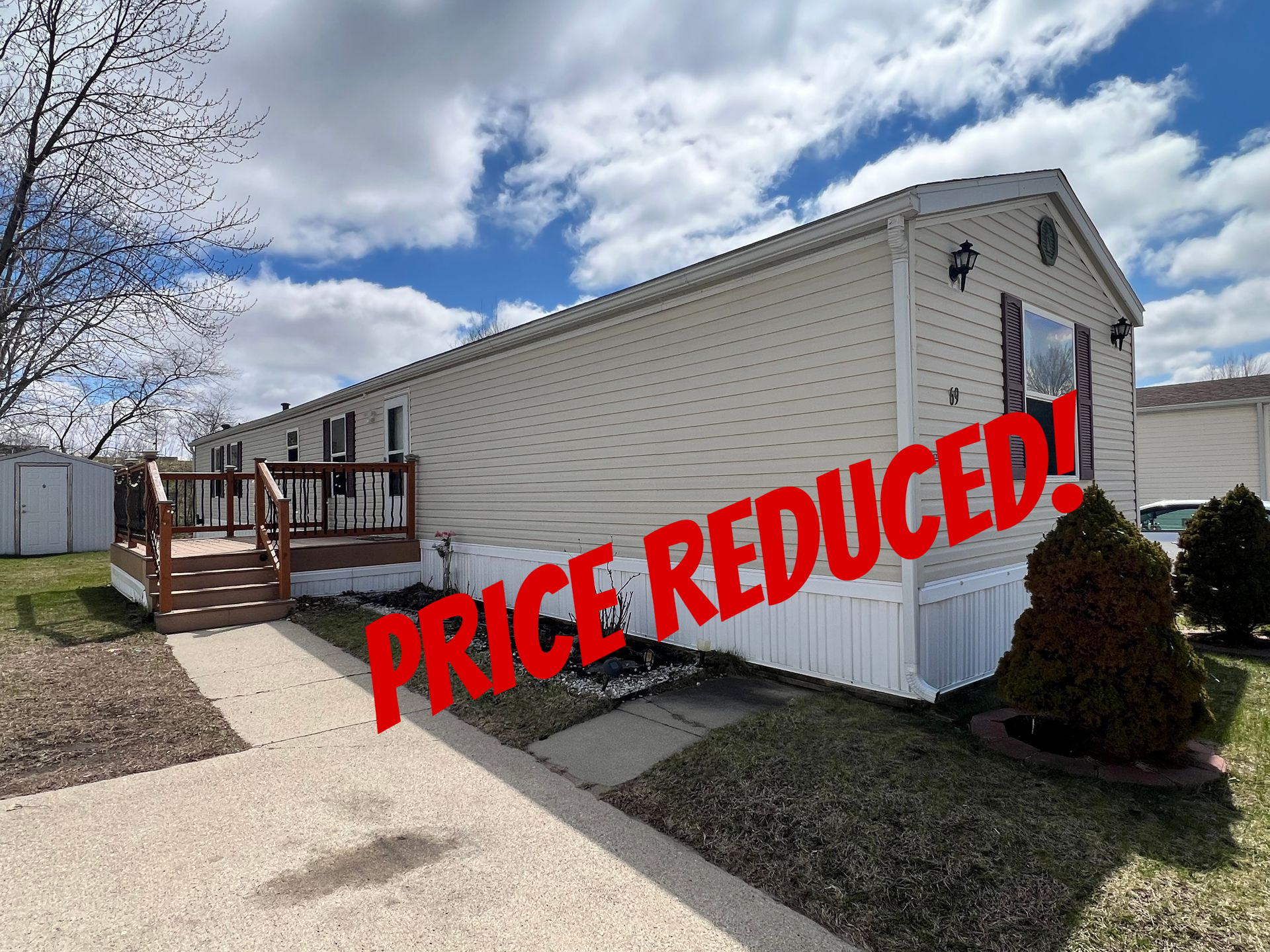 Three stylized houses, with the center one having a chimney and window.