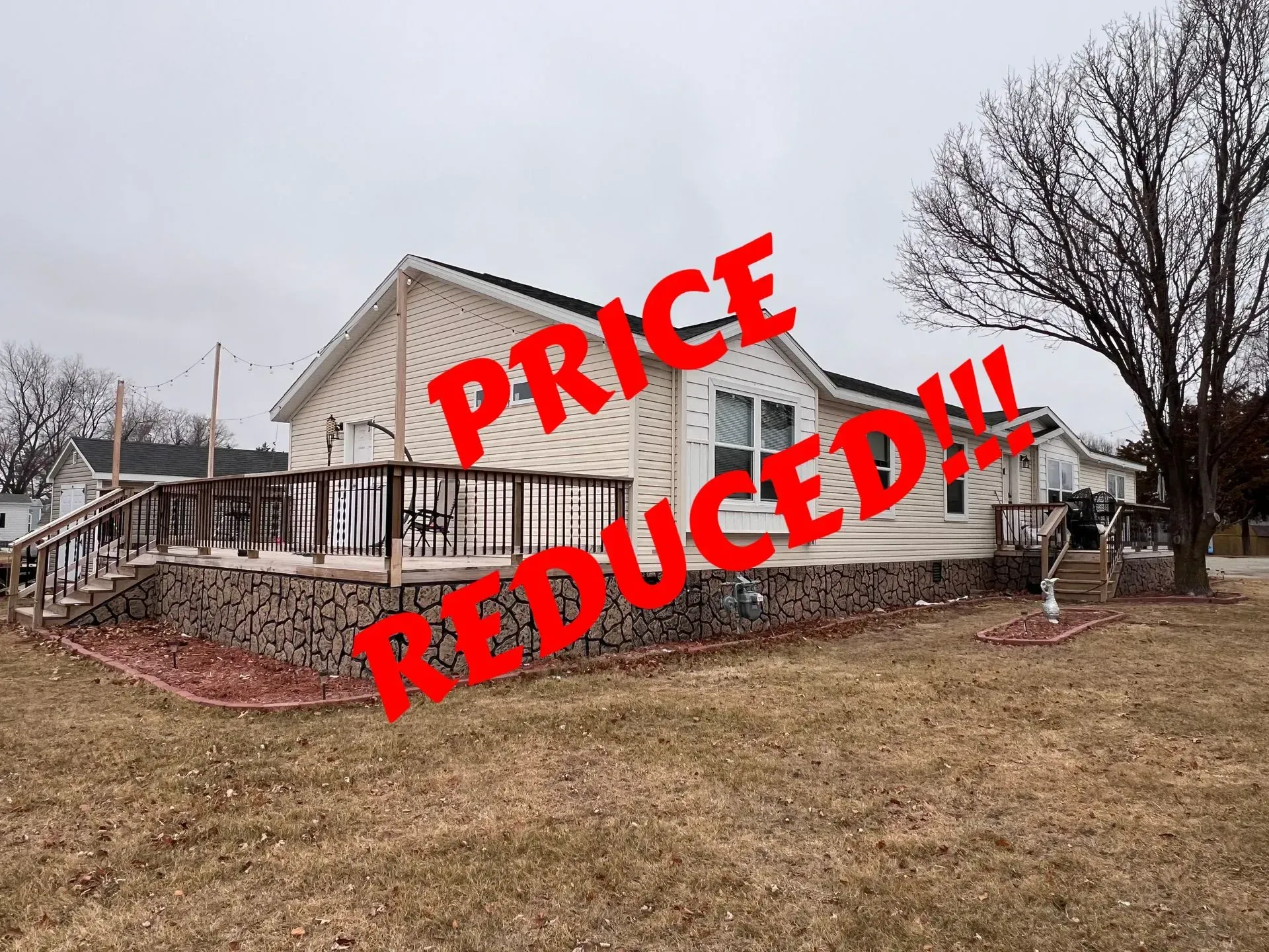 Tan house with a deck;