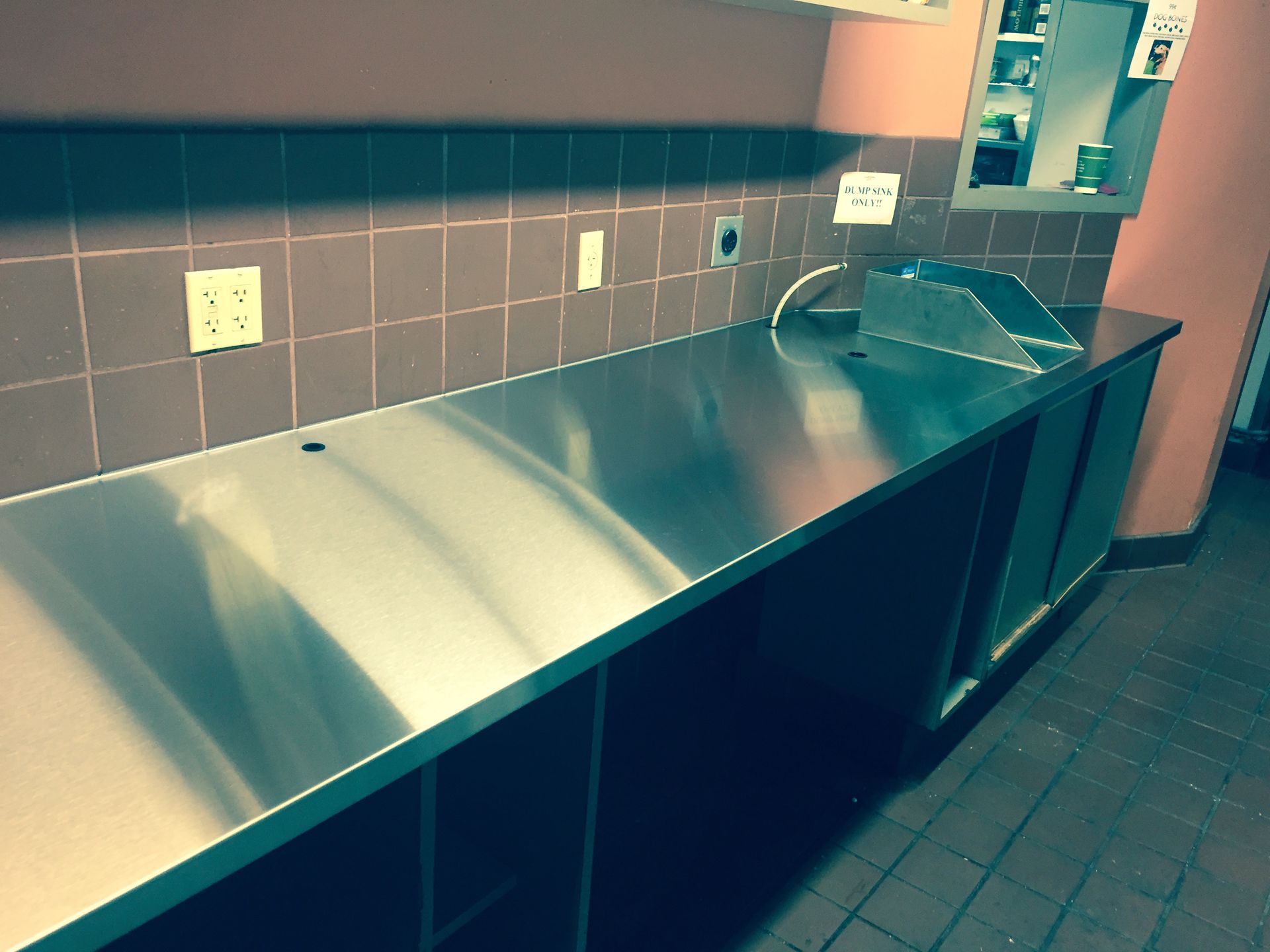 A kitchen with a stainless steel counter top