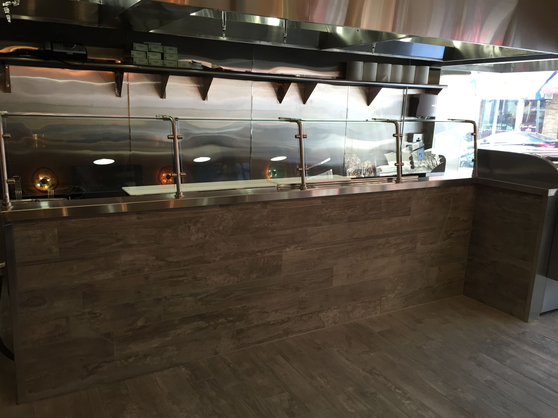 A kitchen with stainless steel appliances and a counter