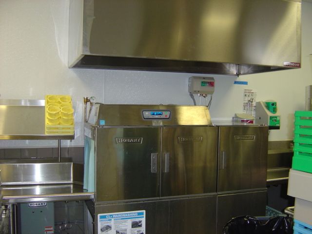 A stainless steel dishwasher is sitting in a kitchen